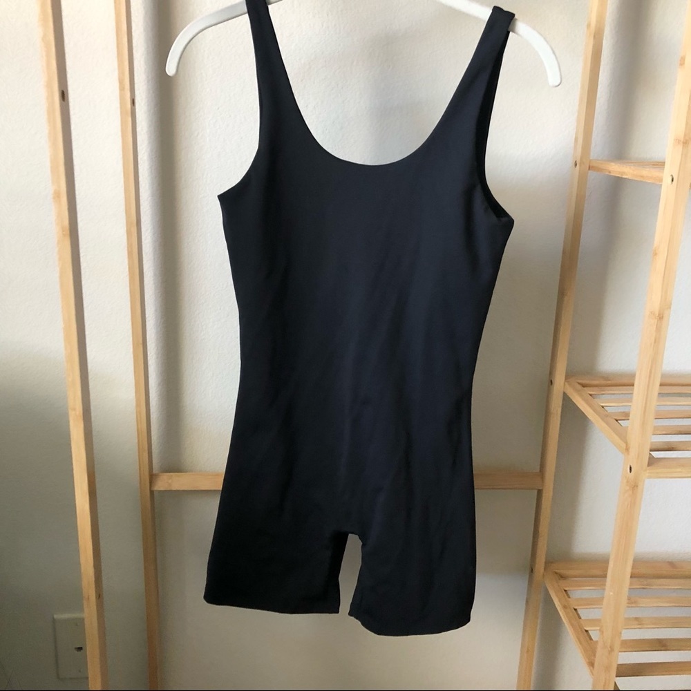 Girlfriend Collective black bike unitard onesie